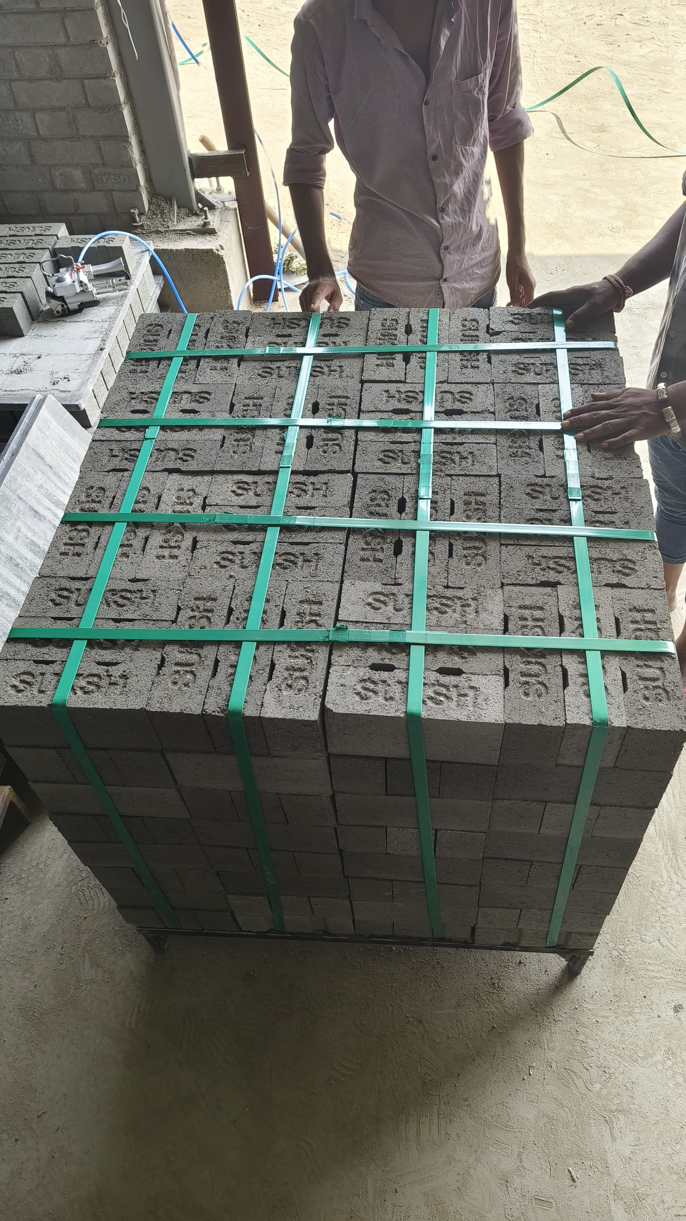 Quality Check — Workers inspecting bricks